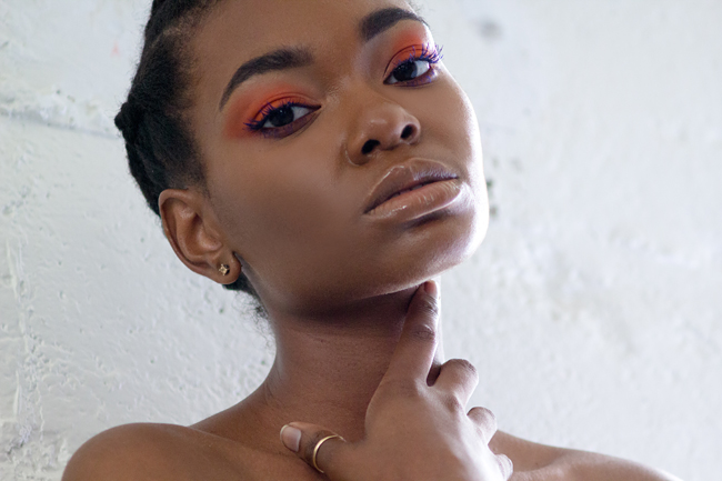 Makeup for black women, Orange eye shadow and blue mascara